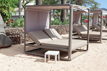 Beach chair on the sandy beach. Vacation and relaxation concept