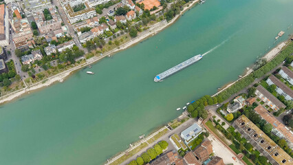 Basel, Switzerland. A tanker cargo barge floats along the Rhine River. Basel is a city on the Rhine River in Switzerland, near the borders with France and Germany, Aerial View