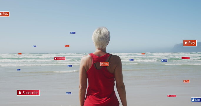 Image of social media data processing over caucasian women exercising on beach