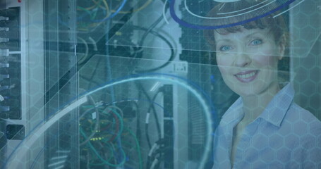 Image of data processing over caucasian woman smiling in server room