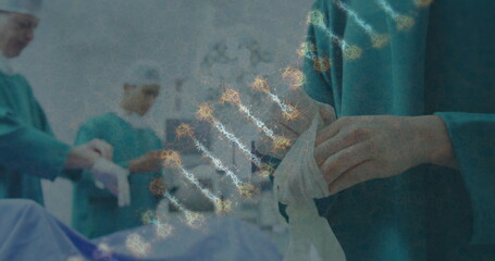 Image of dna strand over surgeons in face masks