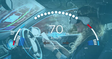 Image of speedometer over caucasian woma nin vr headset driving electric car