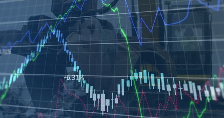 Image of financial data and graphs over machines on junkyard