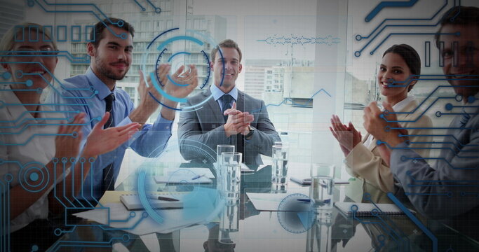 Image of integrated circuit over diverse businesspeople clapping hands in office
