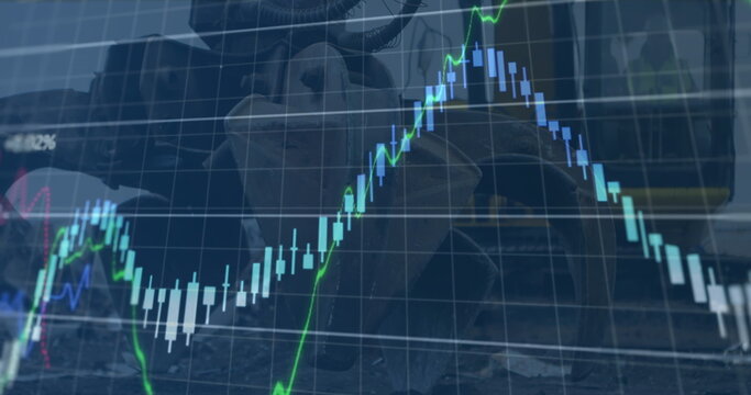 Image of financial data and graphs over machines on junkyard