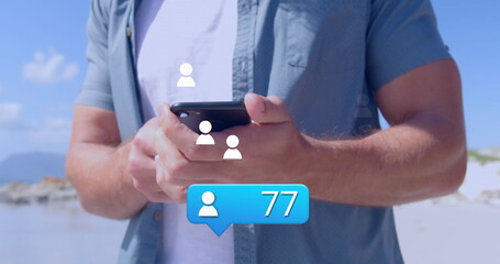 Image of social media icons over smartphone with smartphone <unk> using smartphone