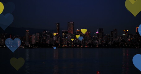 Image of falling hearts over cityscape