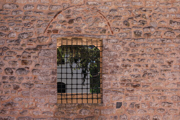 Elements of architectural decorations of buildings, old windows and window openings, arches and patterns. On the streets in Turkey, public places.