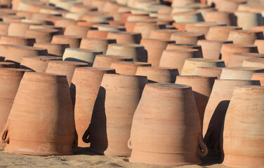 making and preparing clay pots outdoors