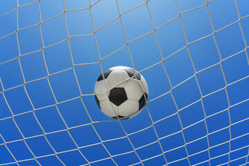  Soccer ball in soccer goal net in a big stadium isolated on blue sky. soccer net.