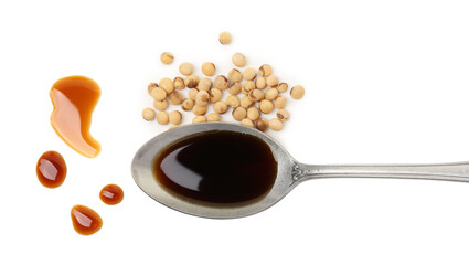 Tasty soy sauce in spoon and soybeans isolated on white, top view