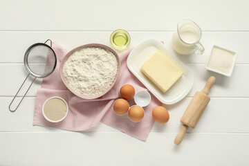 Flat lay composition with fresh butter and other products on white wooden table