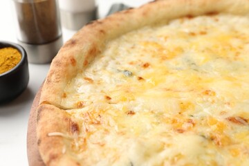 Delicious cheese pizza on white table, closeup