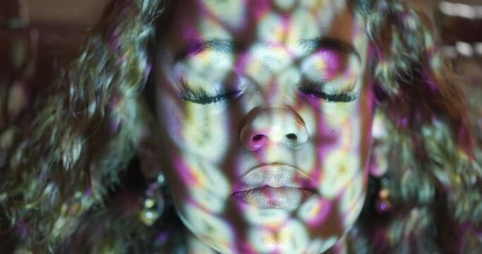 Woman, face and eyes with color lights with depression, sound therapy and psychedelic treatment for ptsd. Person, patient closeup and frequencies for anxiety, mental health and stress with ketamine