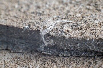 Detailed photography of roof covering material with asbestos fibres. Health harmful and hazards effects.