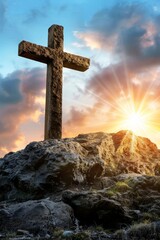 Resurrection symbol  cross on empty tomb stone at sunrise meadow, symbolic good friday concept