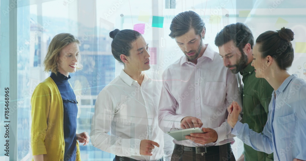 Canvas Prints Image of data processing against diverse businesspeople discussing over digital tablet at office