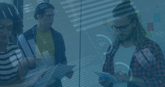 Image of statistical data processing over diverse colleagues with documents discussing at office