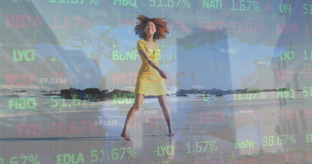 Image of world map and financial data processing over african american woman on beach