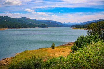 Panoramic view of Dexter Reservoir near Eugene, Oregon, with mountain backdrop. Dexter Reservoir, also known as Dexter Lake, is a reservoir in Lane County formed on the Middle Fork Willamette River.