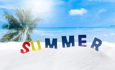 Summer concept background, colorful summer wooden text on white sand over blurred tropical beach...