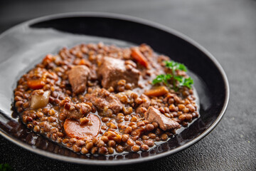 lentils with meat beef or pork fresh cooking appetizer meal food snack on the table copy space food background rustic