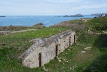 Saint-Malo, France - Apr 11, 2024: Stp. Ra109 Pointe de la Varde forms the North-Eastern defensive corner of the site of St Malo. Atlantic Wall. Sunny spring day. Selective focus.