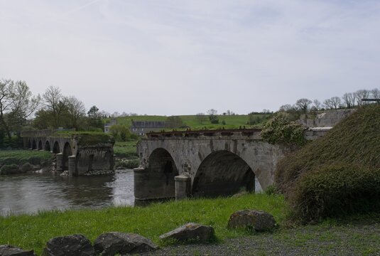 Heugueville-sur-Sienne, France - Apr 14, 2024: La Roque Bridge bombed by the allies during Second World War. Operation Cobra. Sunny spring day. Selective focus.