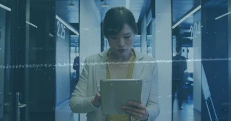 Rolgordijnen Aziatische plekken Image of financial data processing over asian businesswoman using tablet in office