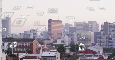 Image of eco icons and data processing over cityscape