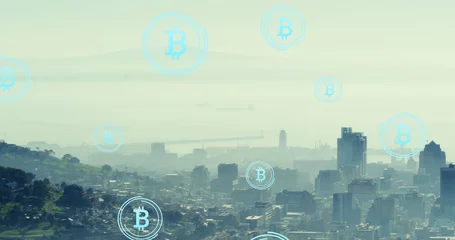 Tuinposter Image of bitcoin icons floating over aerial view of cityscape against cloudy sky © vectorfusionart