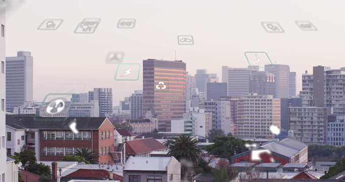 Image of eco icons and data processing over cityscape