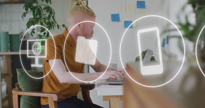 Image of network of icons over albino businessman using smartphone