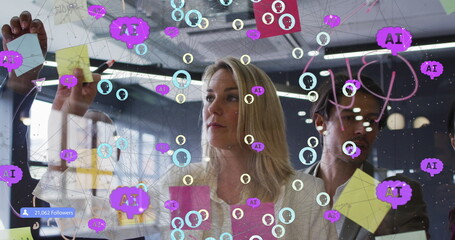 Image of connected people and ai icons over diverse woman with man sticking note on glass wall
