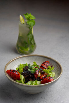 chicken liver saladFresh salad with quinoa, olives, tomato and arugula .chicken liver salad