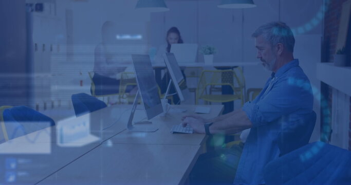 Image of stock market data processing against caucasian man using computer at office