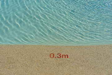 Entrance to the pool with a depth indication of 0.3 meters.