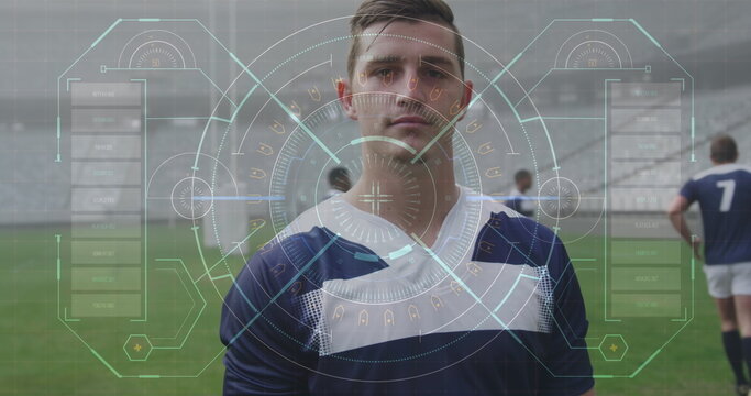 Image of data and statistics over Caucasian male rugby player standing on a pitch digital compositio