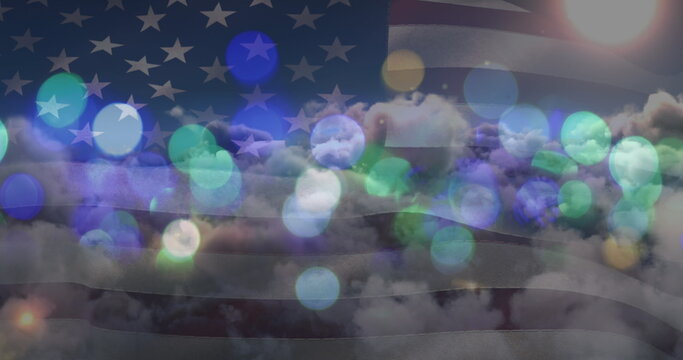 Fototapeta Image of glowing spots over sky with clouds and american flag