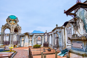 Historic tombstones in monumental cemetery of Sant'Abbondio in Collina d'Oro, Switzerland