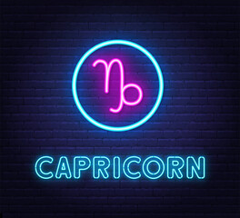 Neon Capricorn Sign on brick wall background.