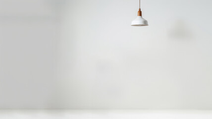 Single hanging light in a minimalist setting - obrazy, fototapety, plakaty