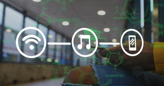 Image of scientific data and tech icons over hands of caucasian man using smartphone