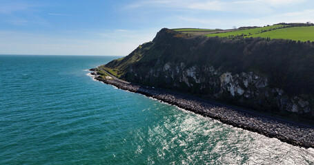 Aerial view of the Beautiful County Antrim Coast Road near Glenarm Village Northern Ireland