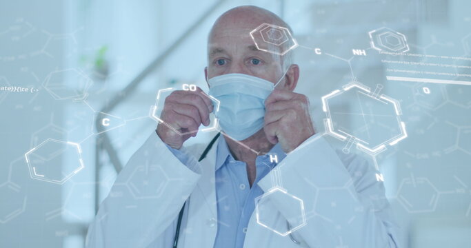 Image of chemical formula over caucasian male doctor wearing face mask