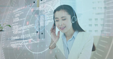 Image of data processing over asian businesswoman wearing phone headset using laptop at office