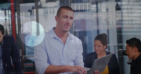 Image of statistical data processing over portrait of caucasian man using laptop at office