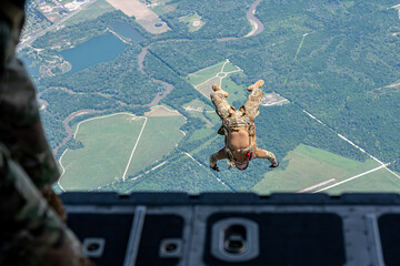 A man is doing a parachute jump from a plane