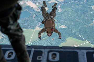 A man is doing a parachute jump from an airplane