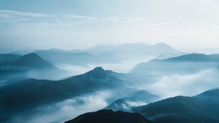Hushed view of a mountain vista, with fog-covered peaks and sprawling valleys devoid of any human interference 01